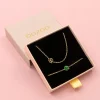 Goudkleurige armband + ketting set met een groene klaver