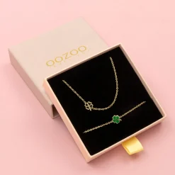 Goudkleurige armband + ketting set met een groene klaver