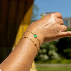 Goudkleurig/groene armband met een klaver