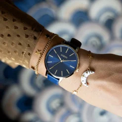 Goudkleurig/witte armband met een maan bedeltje