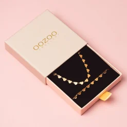 Rosé kleurige armband + ketting set met hartjes