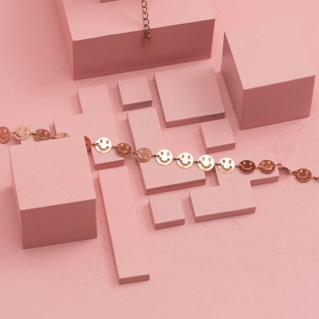 Rosé kleurige armband met smileys